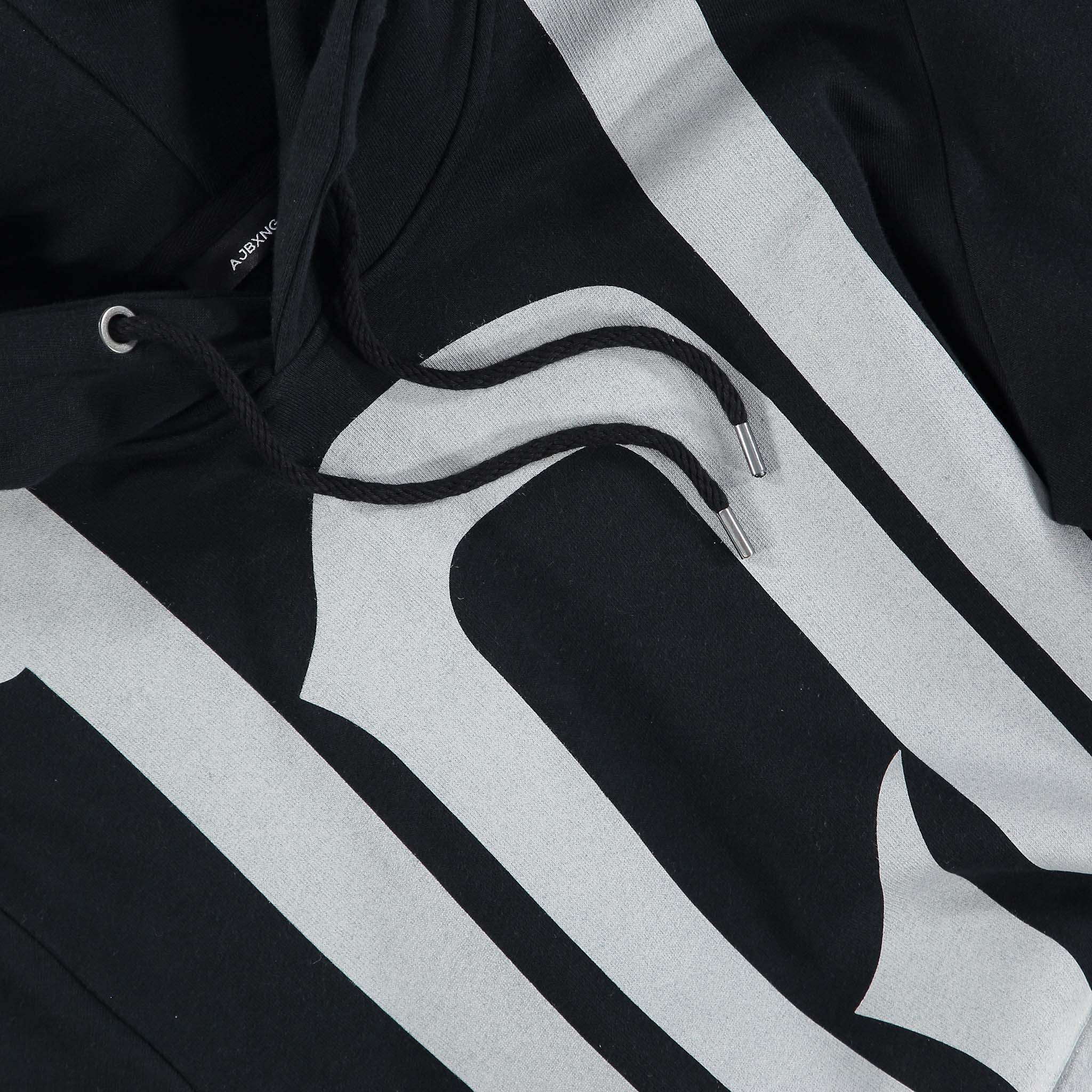 Close up of the Winners Attitude oversized logo print on a black hoodie